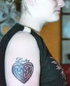 celtic heart women's arm tattoo